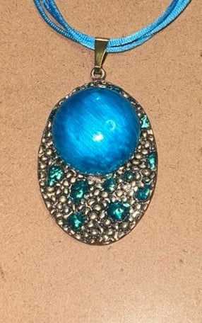 Vintage Pendant with Vintage Artisan Glass Beads and Crystals on a blue cords.