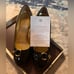 Black and Gold Coach Heels
