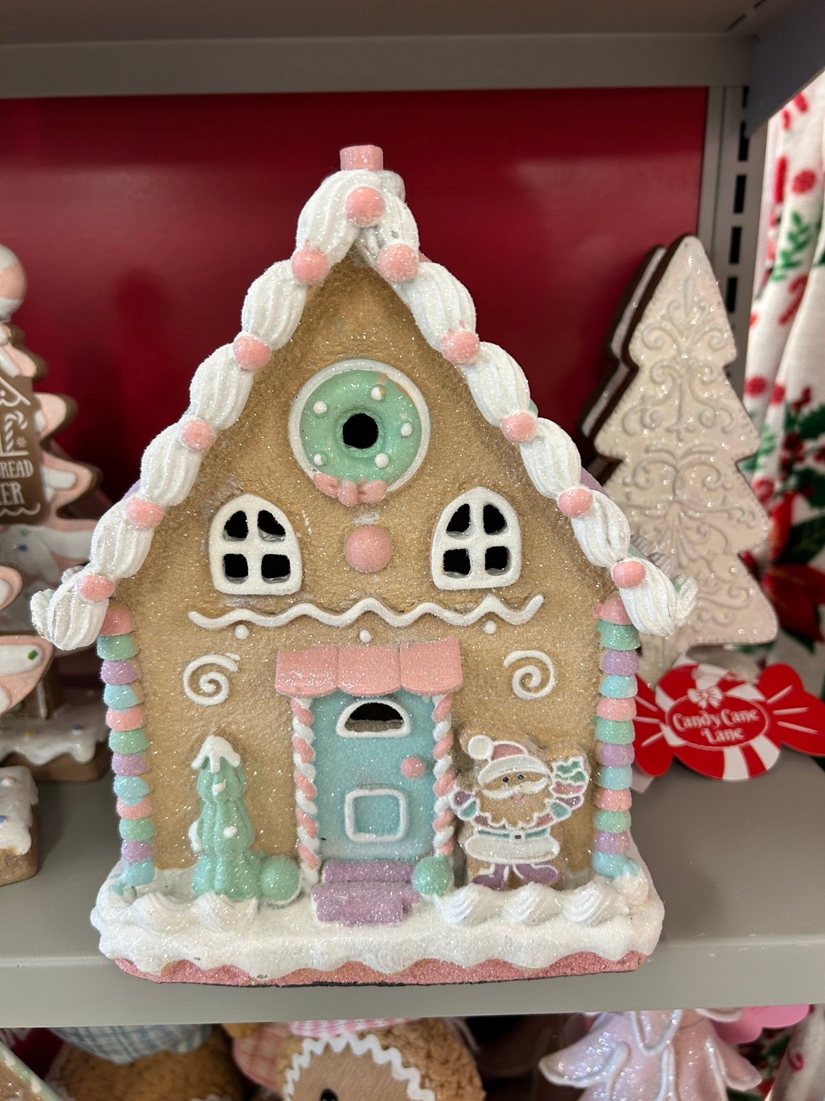 Christmas Lighted Pastel Gingerbread House with Santa Claus