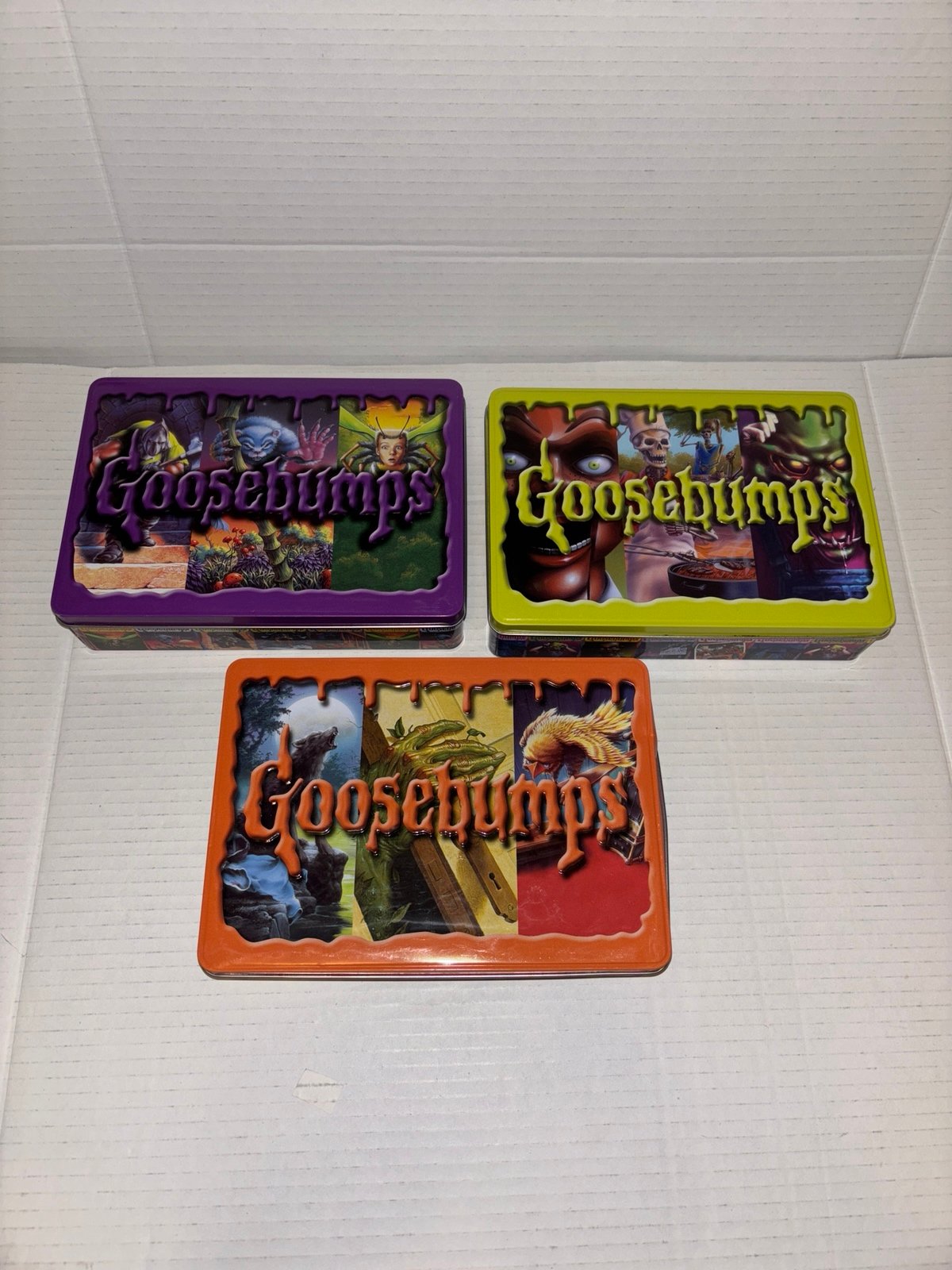 Three Goosebumps Metal Storage R L Stine Containers in Different Colors