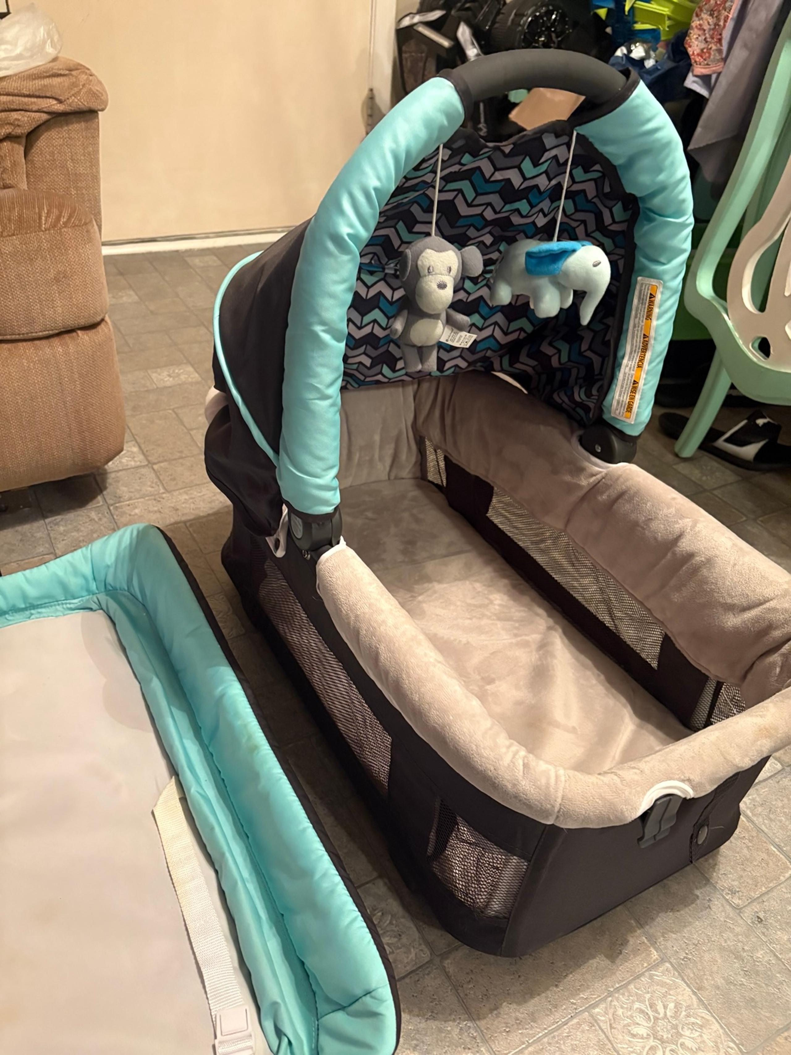 Versatile Infant Travel Bassinet with Easy-Clean Materials & Cosleeping Safety