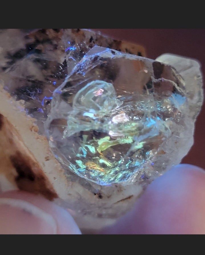 Skeletal golden enhydro petroleum quartz with multi-colored fluorescence