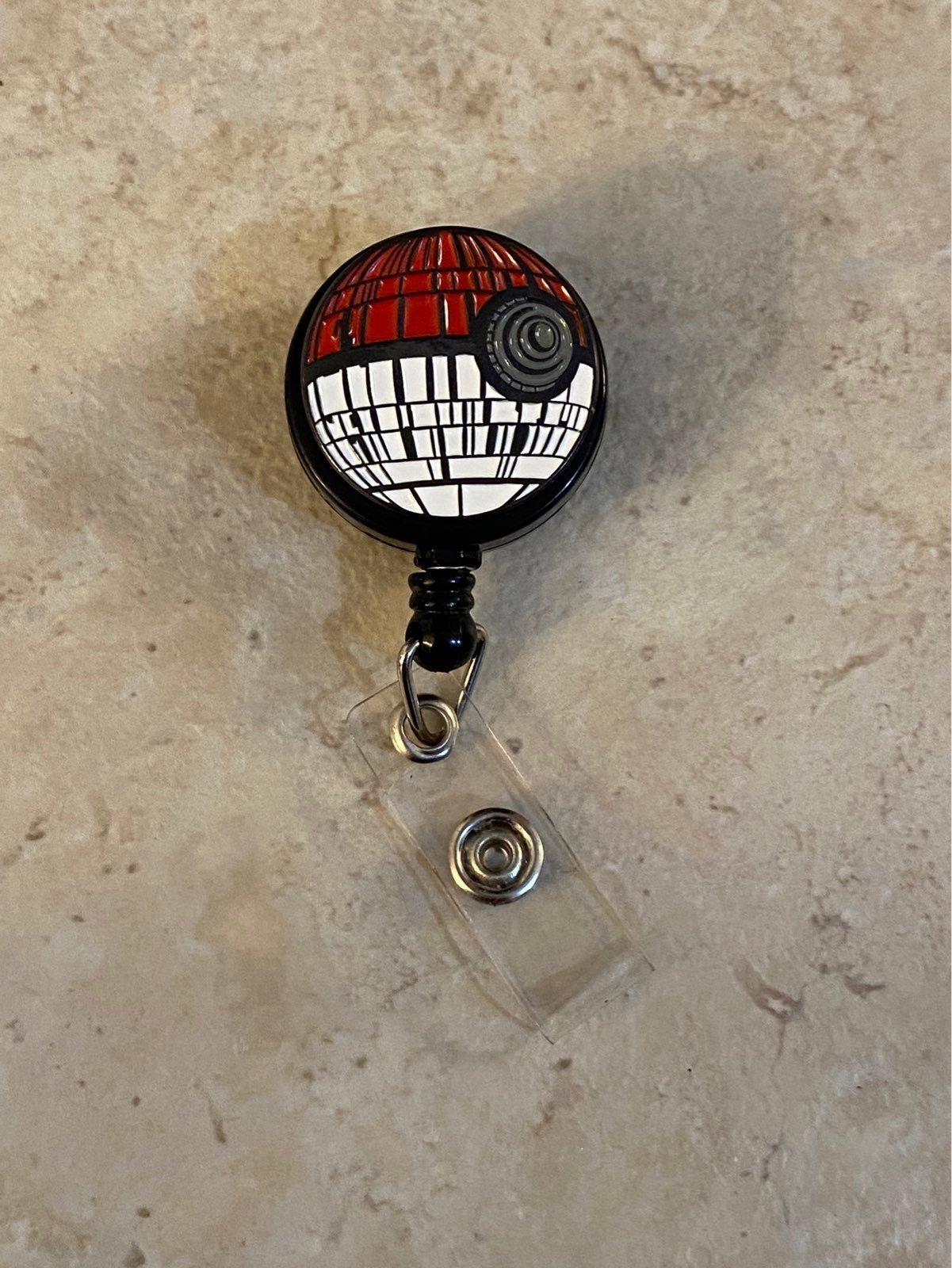 Two starwars Pokemon pokeball death stars badge reel