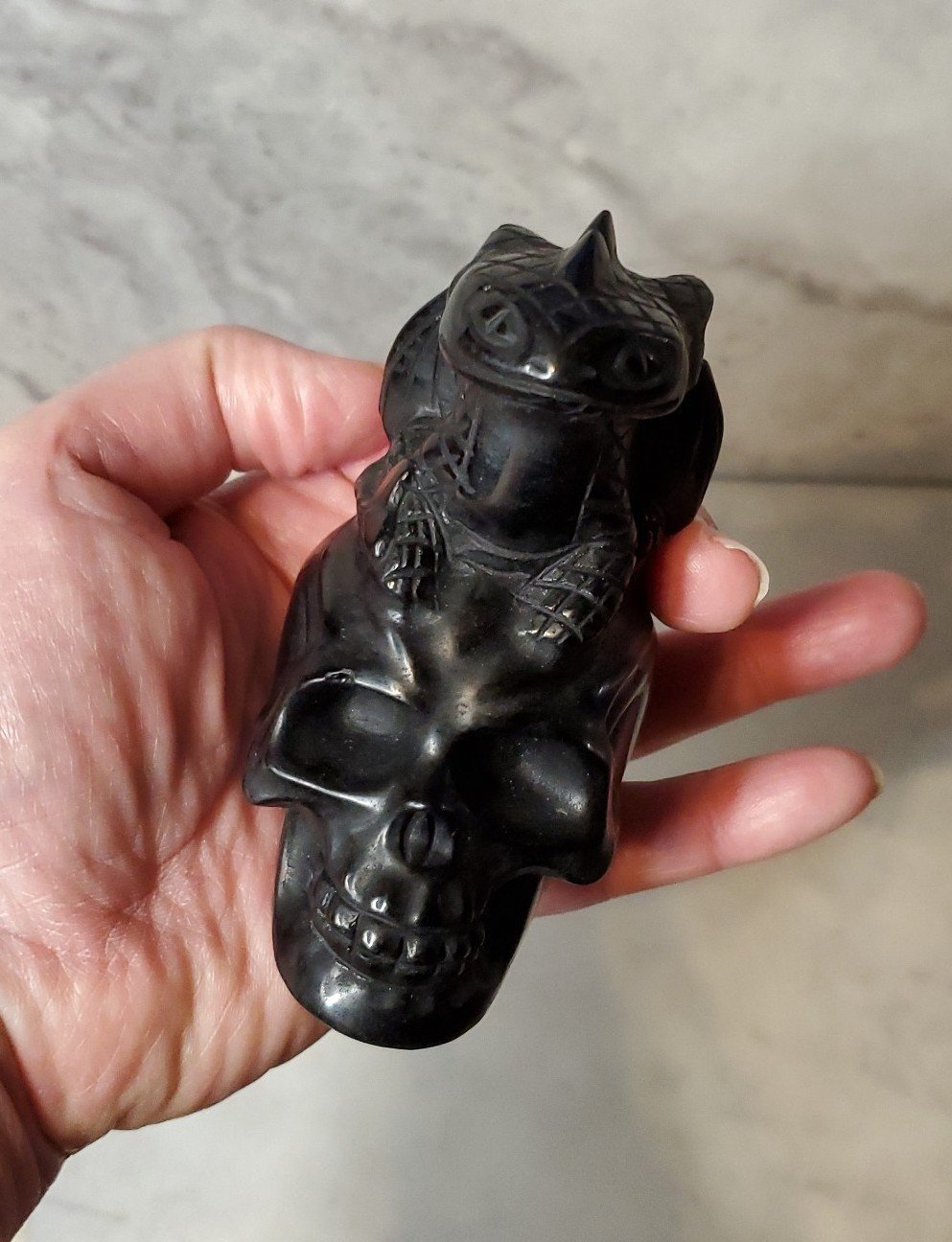 Over 3.5 Tall Black Obsidian Crystal Dragon Sitting on a Skull.
