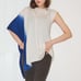 vintage 90s to 2000s ivory and sapphire asymmetric sleeveless poncho sweater.