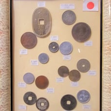 Large assortment of Japanese coins in nice frame