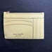 Kate Spade coin case / card holder in yellow.