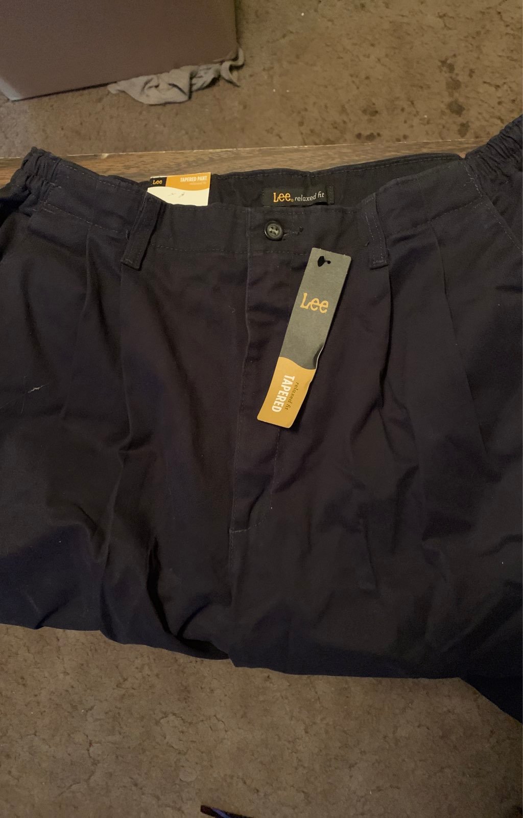 Two pairs of lee tapered pants 22w new/like new