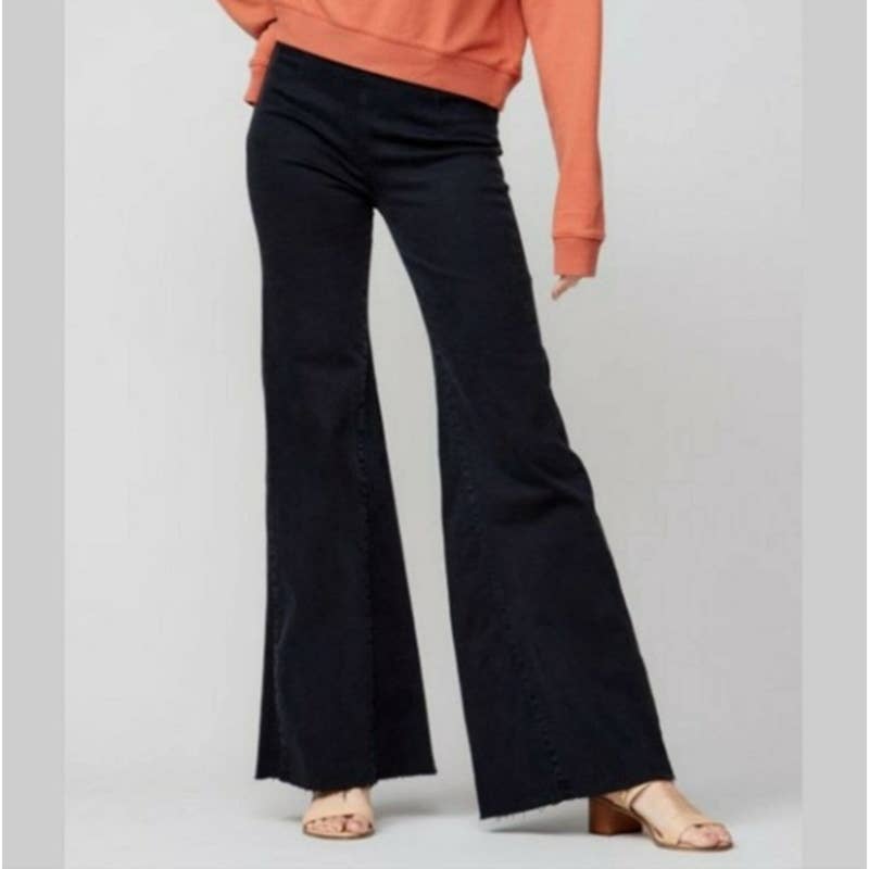 Free People We The Free Drapey Pull On Raw Hem Flare Jeans in Black