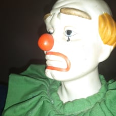 Musical porcelain clown doll