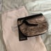 Prune black and gold clutch