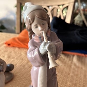 Girl figurine with flute