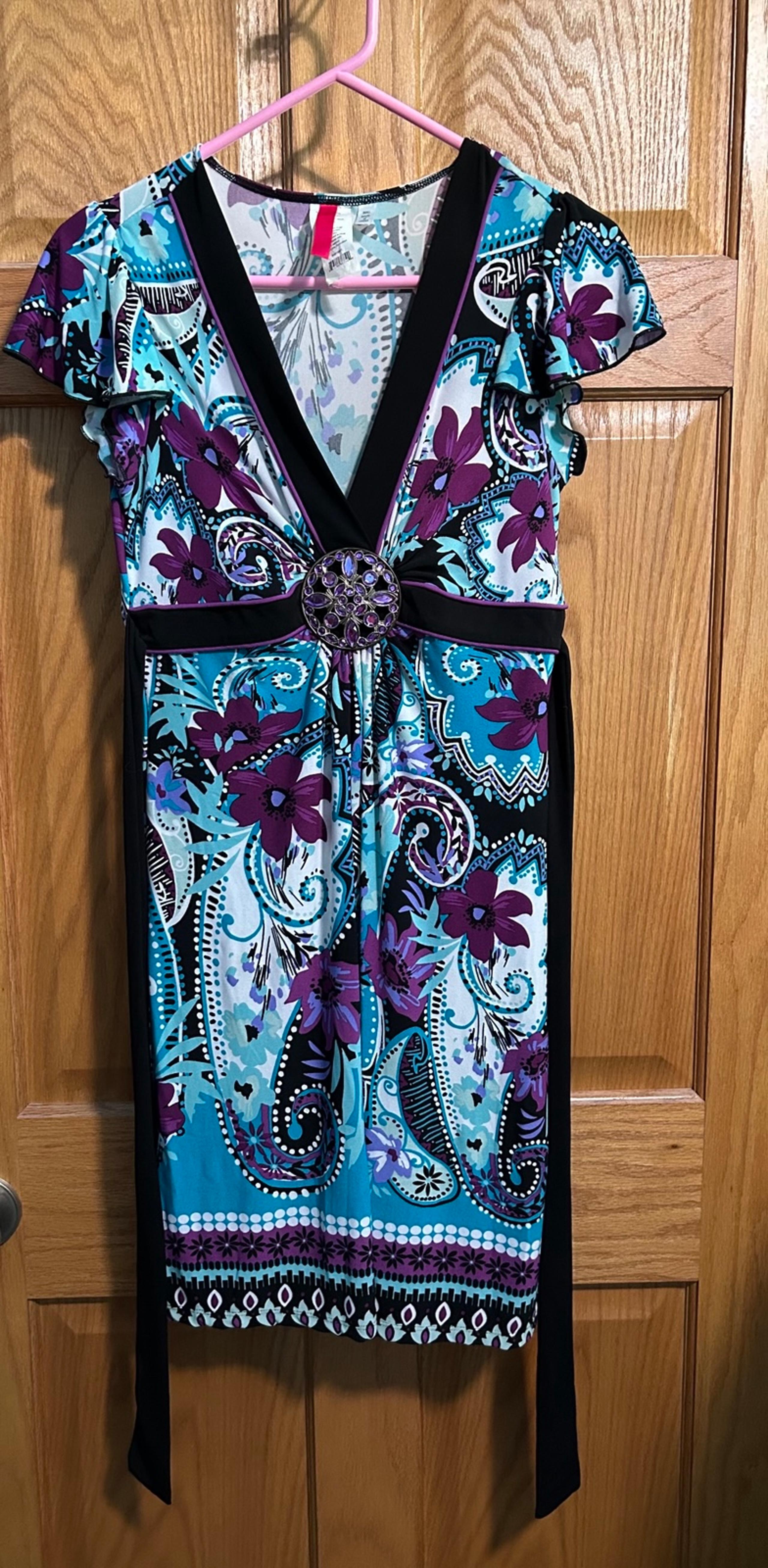 Floral dress with rhinestone broach