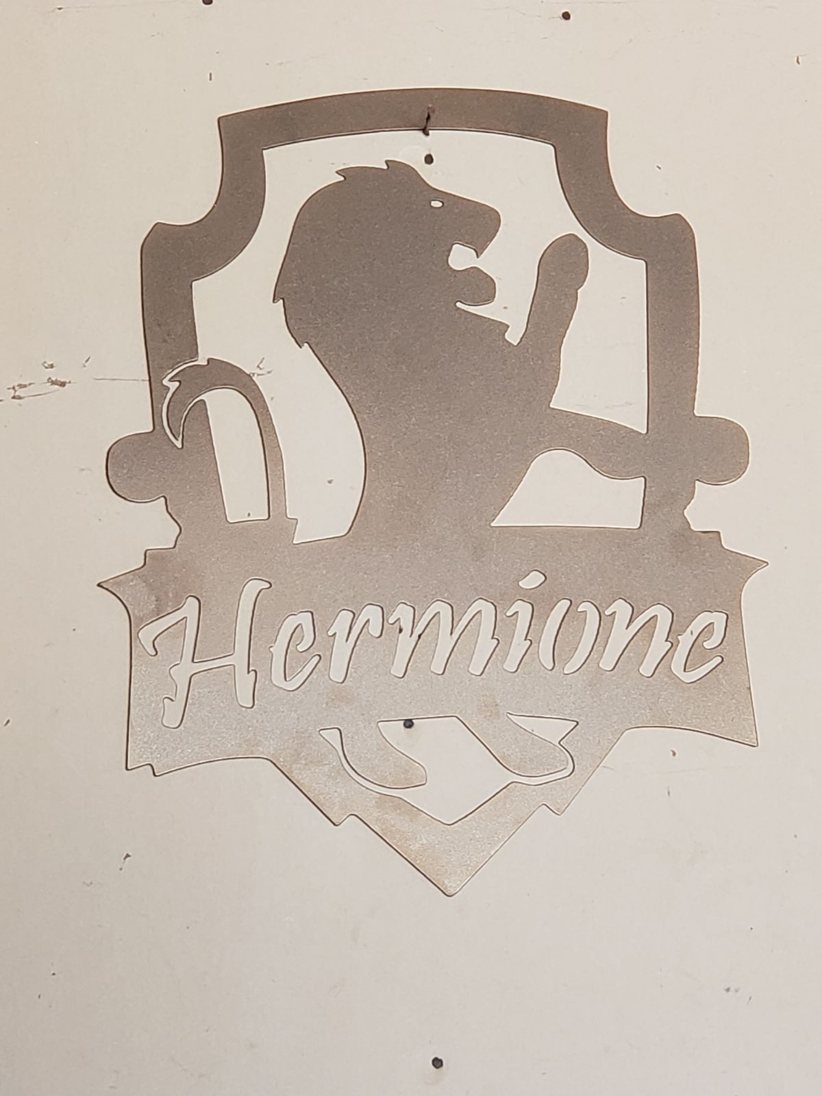 Custom monogrammed steel emblem