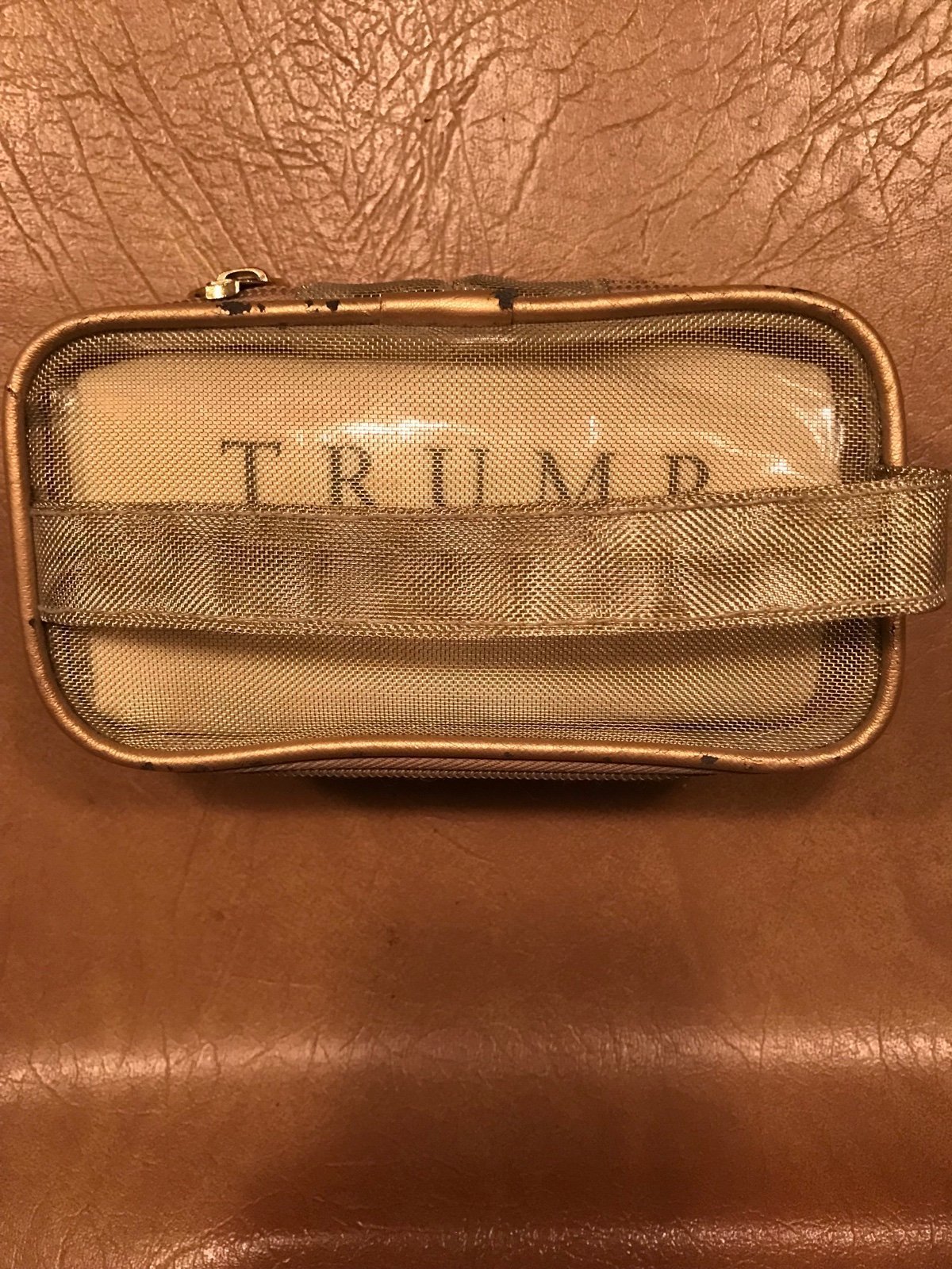 Trump Pouch/cosmetic bag, items inside, see pictures.