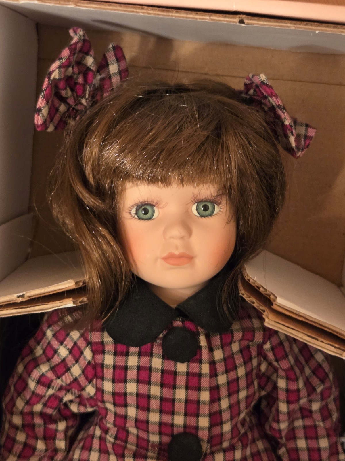 Brunette porcelain figure skating doll
