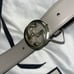 Gray Gucci belt