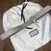 Gray Gucci belt