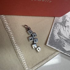 RETIRED James Avery “Family” charm in sterling silver