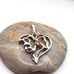 Silver tone melted heart pendant pink crystal detailing