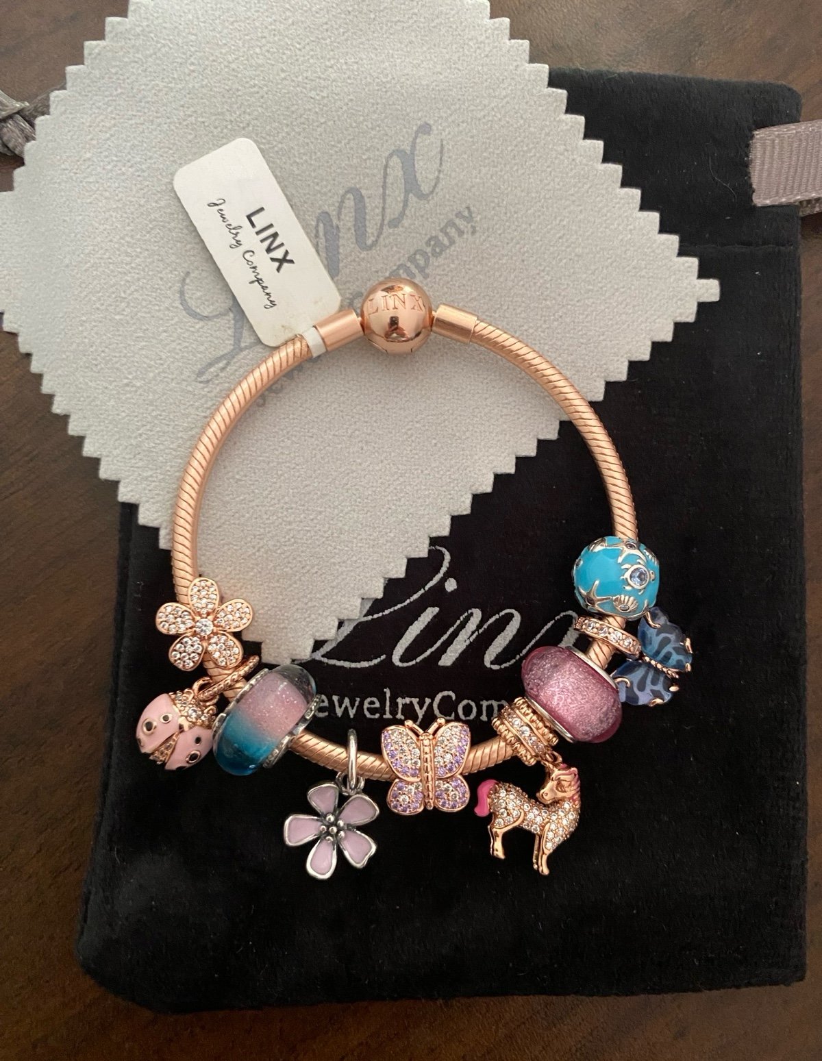 Linx Rose Gold Snake Chain Bracelet with Pale Pink and Baby Blue Themed Charms