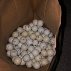 90 assorted golf balls