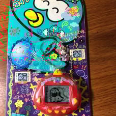 Rakuraku Dinokun 24 in 1 virtual pet. Red Dinkie Dino
