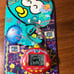 Rakuraku Dinokun 24 in 1 virtual pet. Red Dinkie Dino