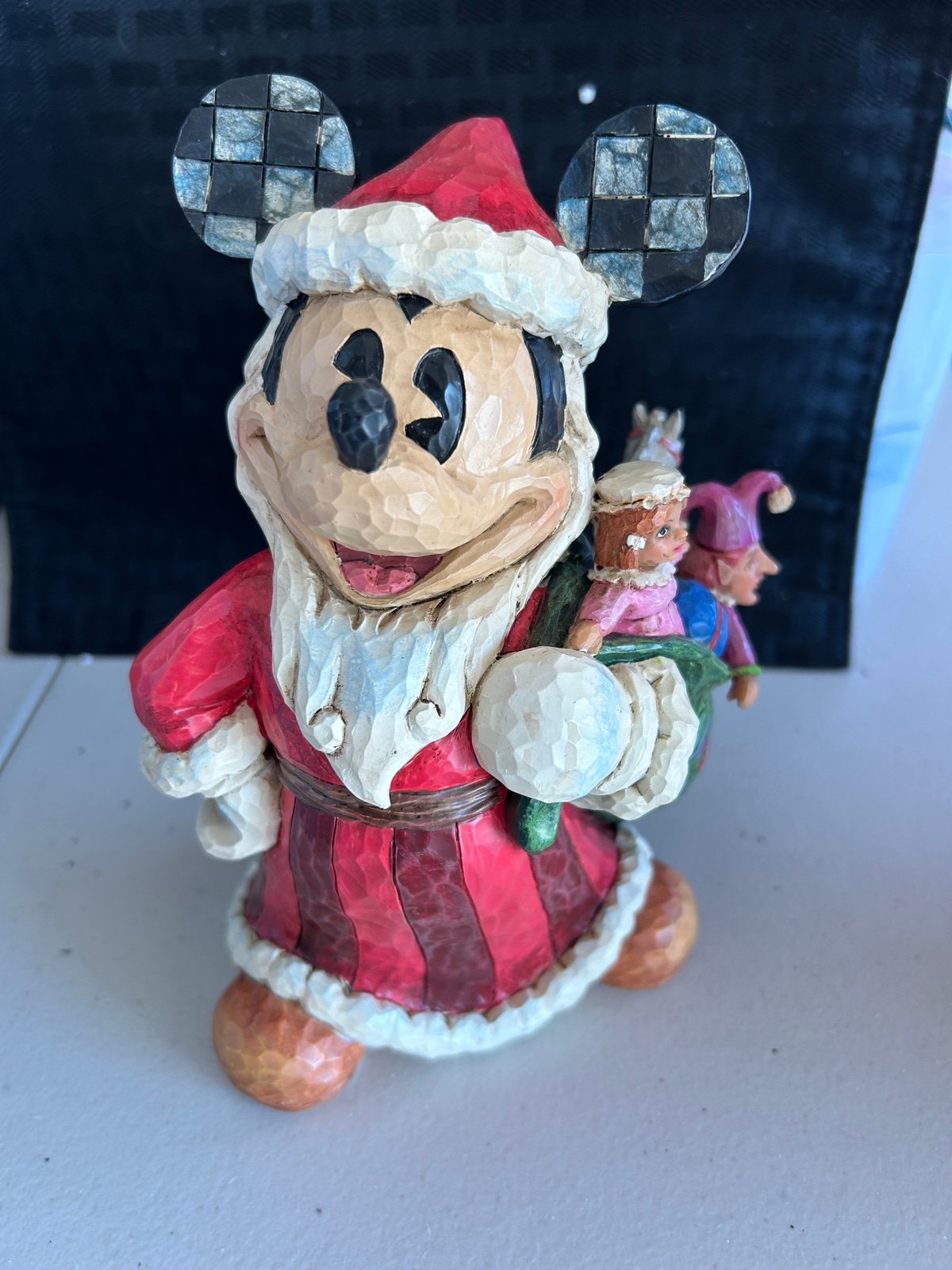 Jim shore Disney toys to the world