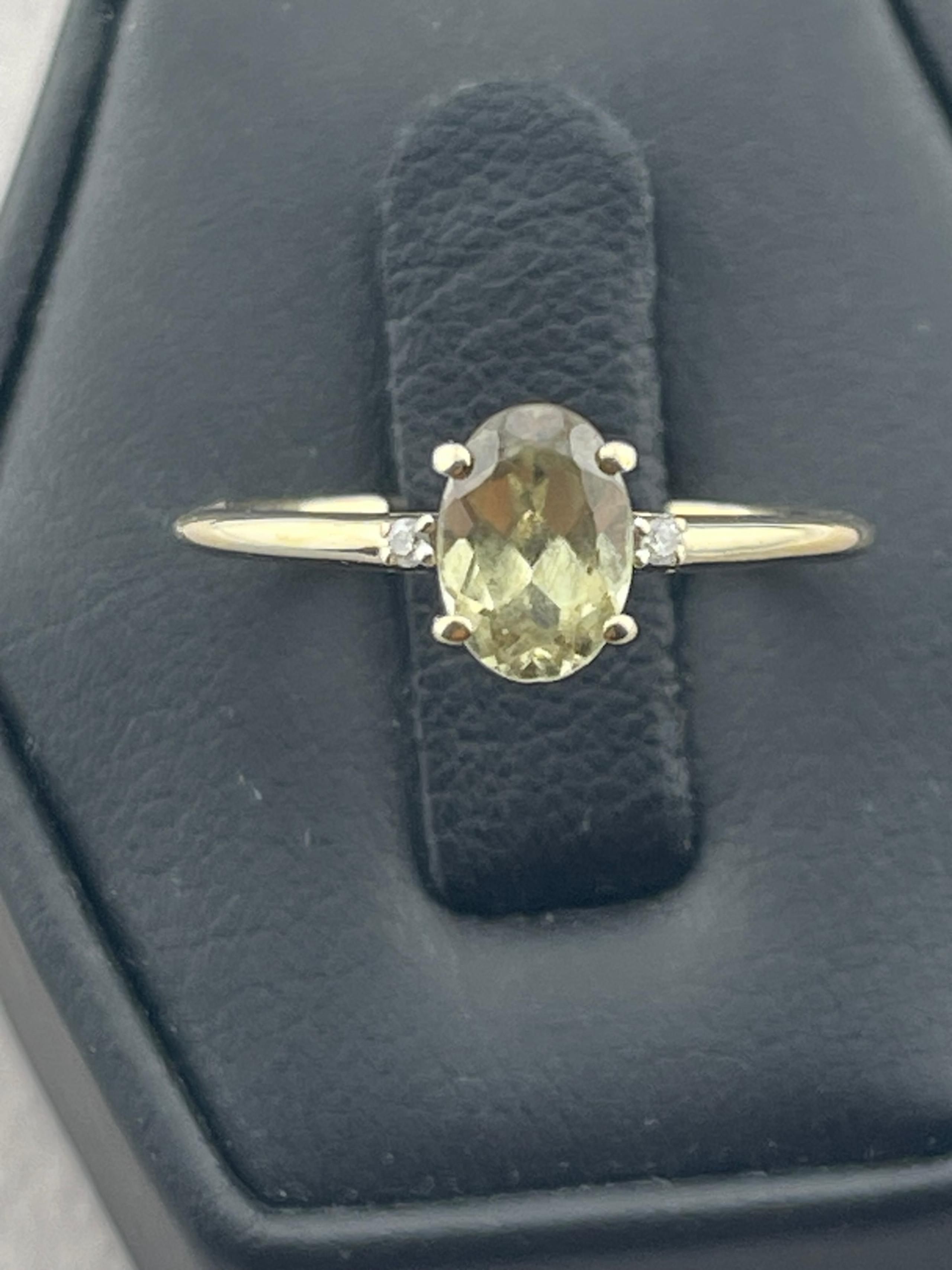 Vintage1/2 carat peridot and diamond ring 10 karat yellow gold