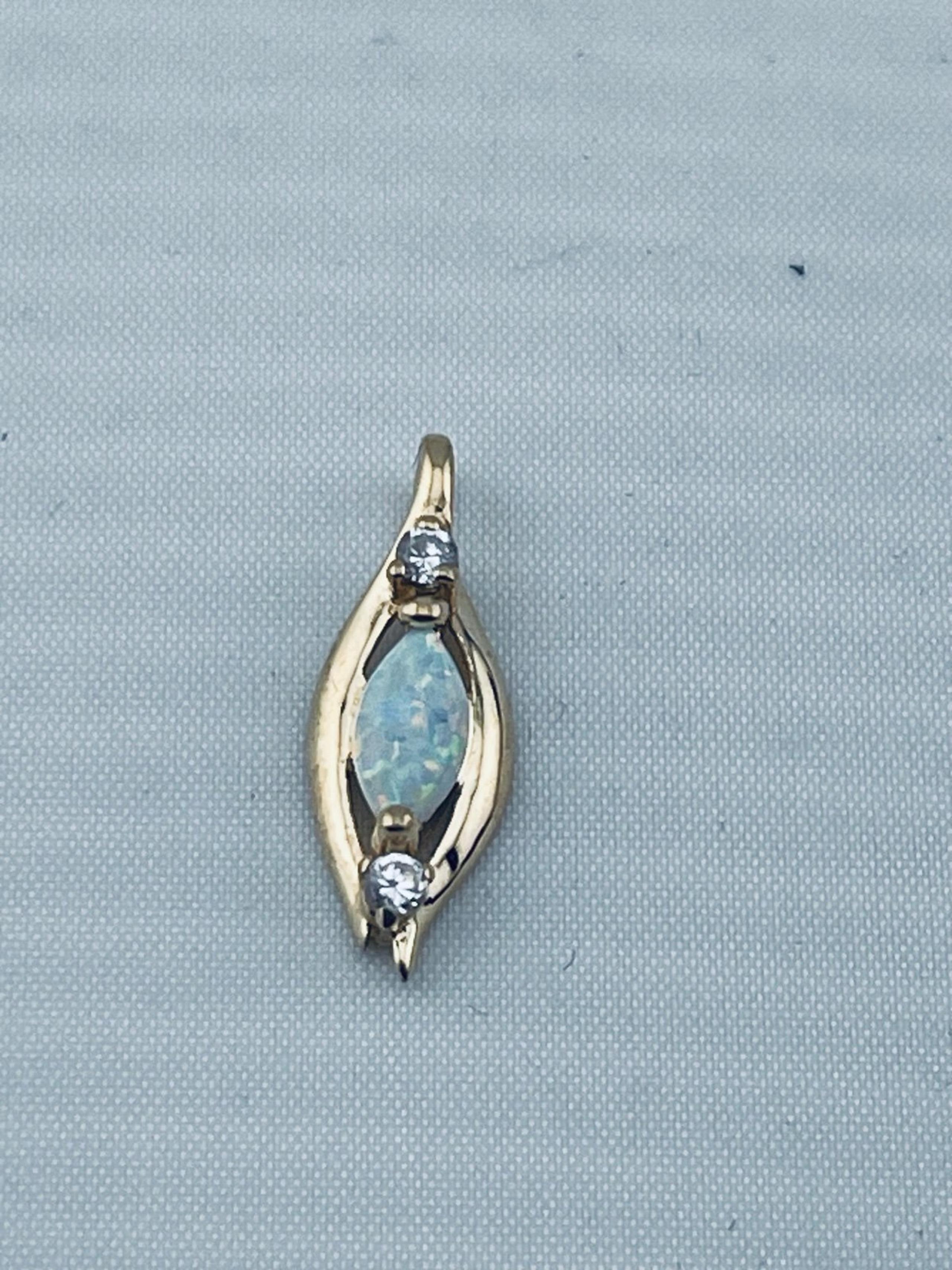 Antique opal and diamond art deco pendant 14 karat yellow gold