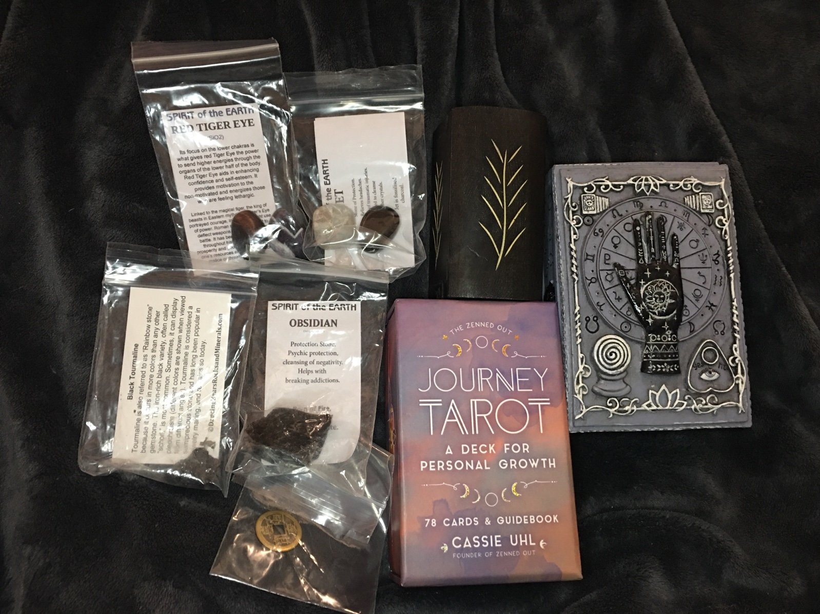 Tarot deck, crystal bundle, and jewelry boxes