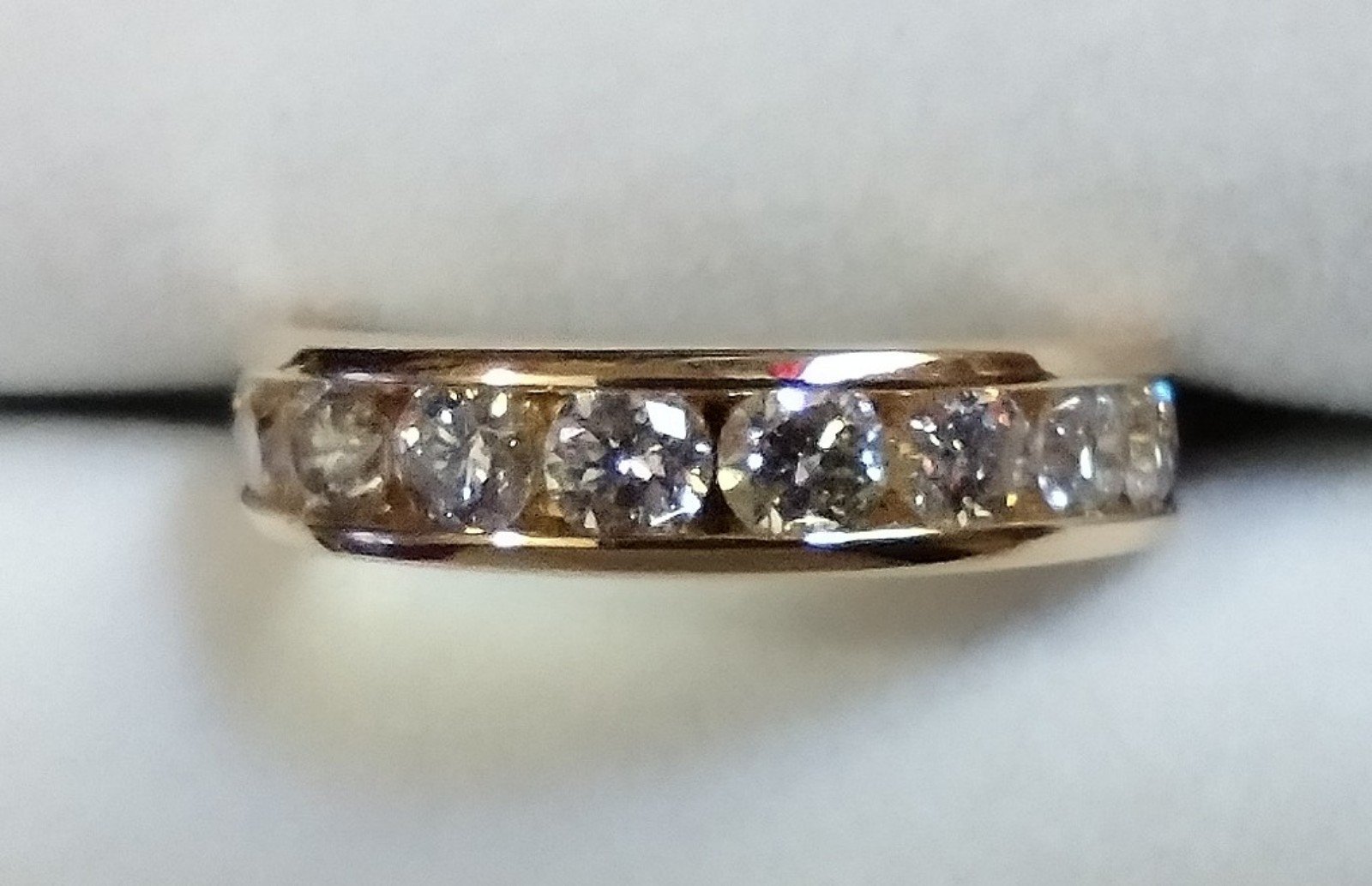 Gordon's Jewelers 1.5 CTW DIAMOND channel set band ring in 14K gold. Size 6
