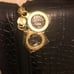 Estee Lauder crocodile print travel purse