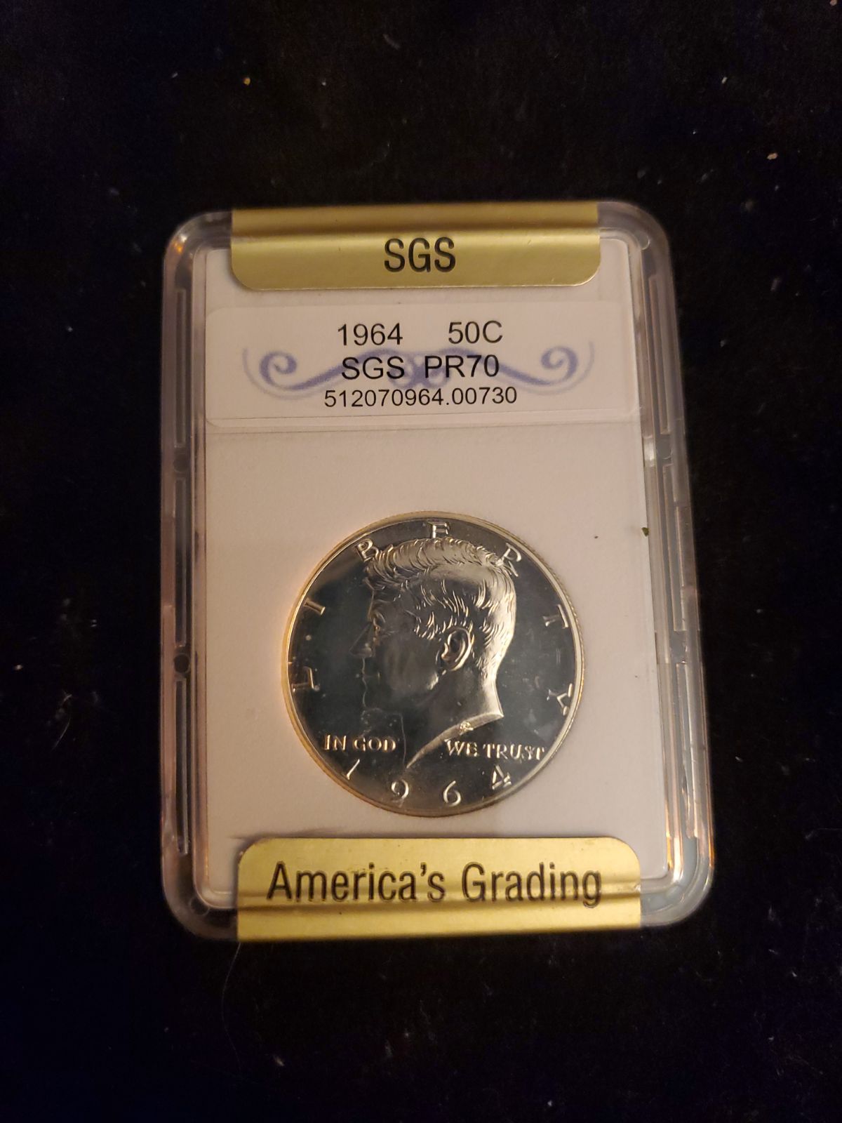 Graded 1964 silver Kennedy half dollar