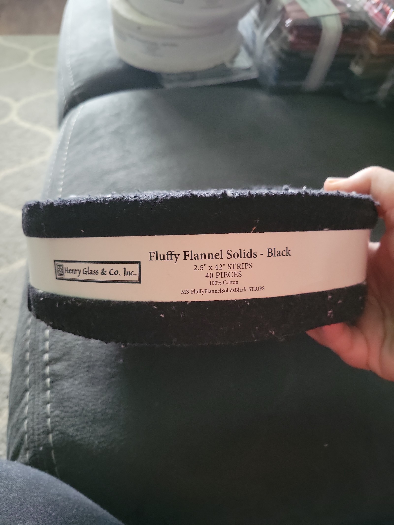 Fuzzy flannel solids black. Fabric strip roll
