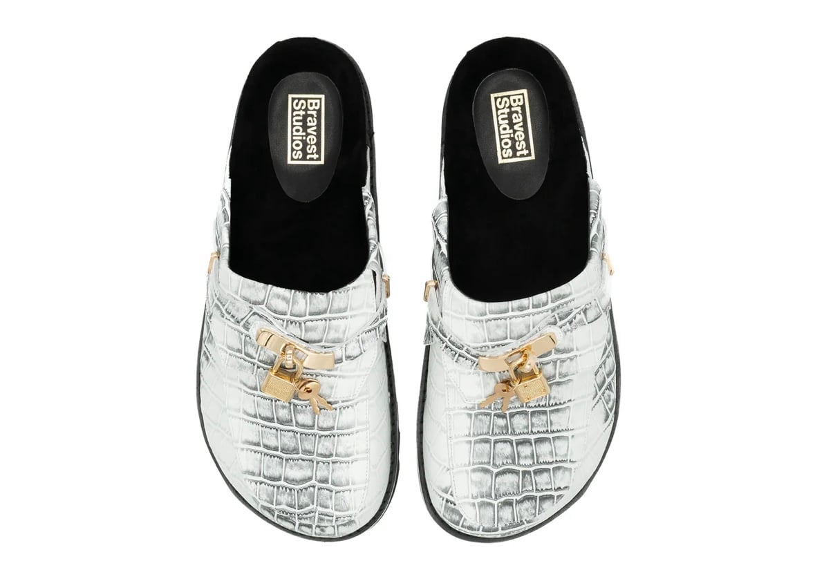 White snakeskin clogs