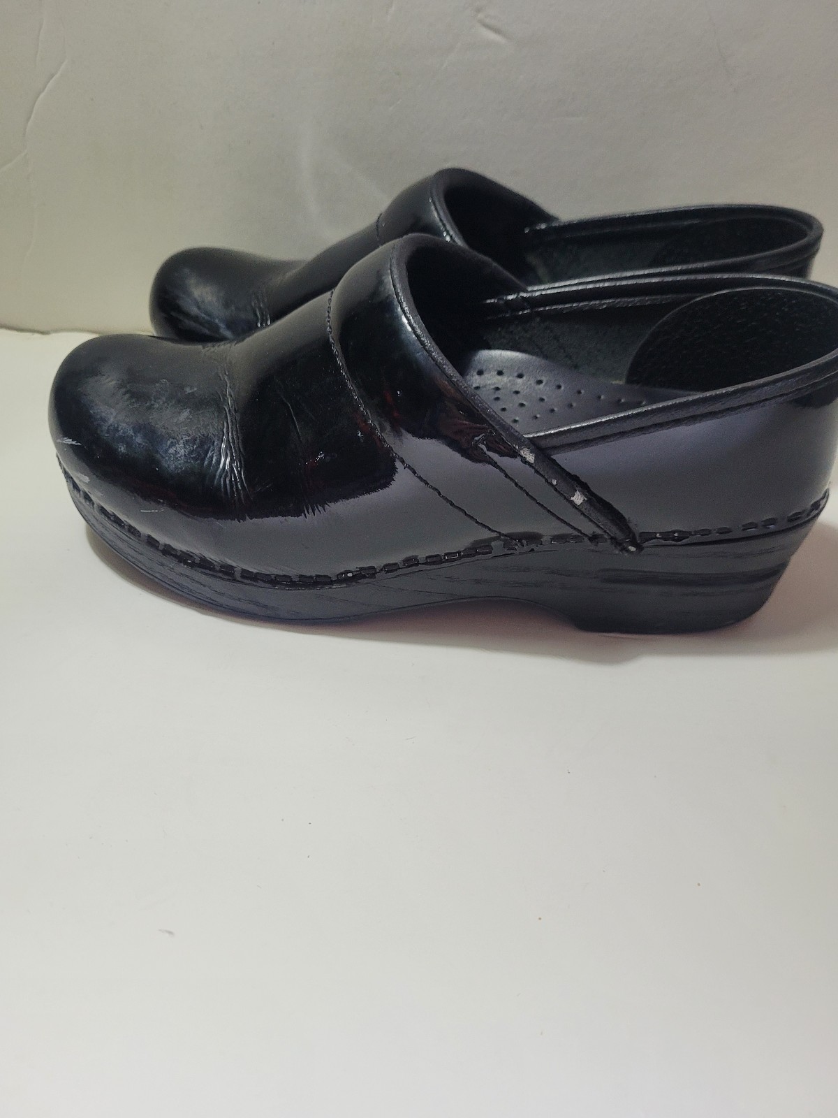 Dansko clogs black patent stapled professional shoes