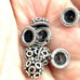 Lot of 14 Sterling Bali bead caps. Sv37