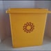MCM Tupperware Waste Basket With Yellow & Red Starbust Design.