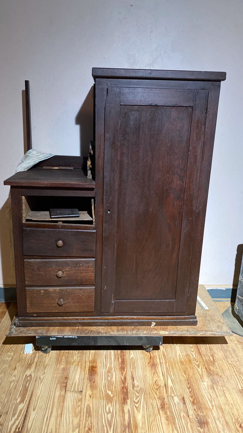 All wood cabinet, wooden wheels, clothes