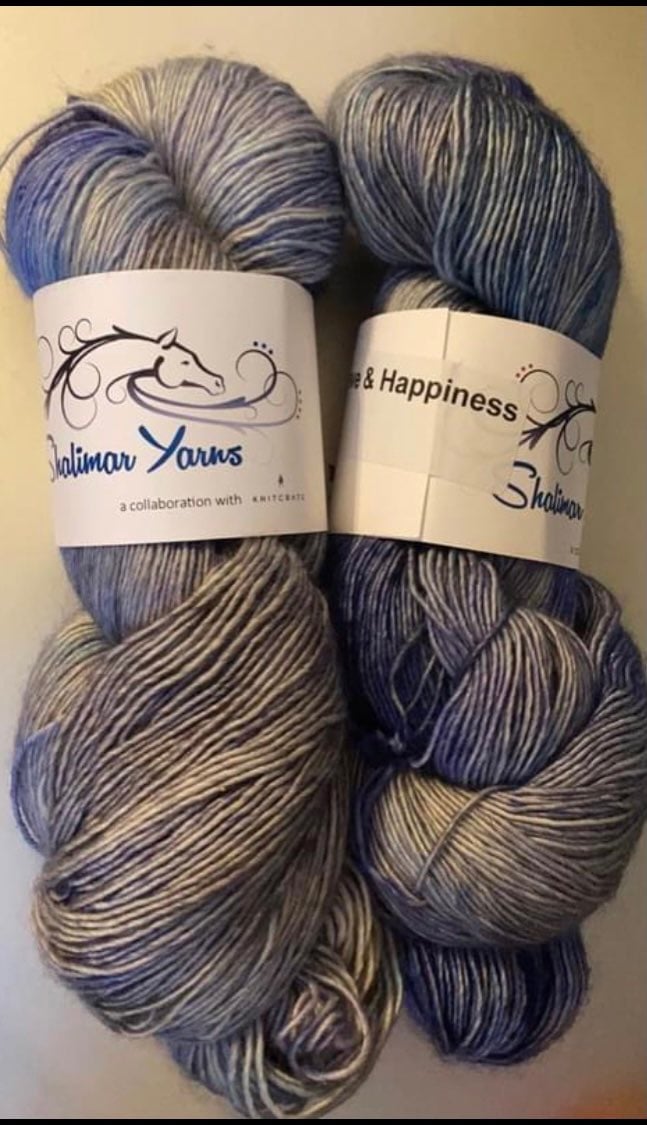 2 hanks shalimar aerie fingering yarn in love & happiness.