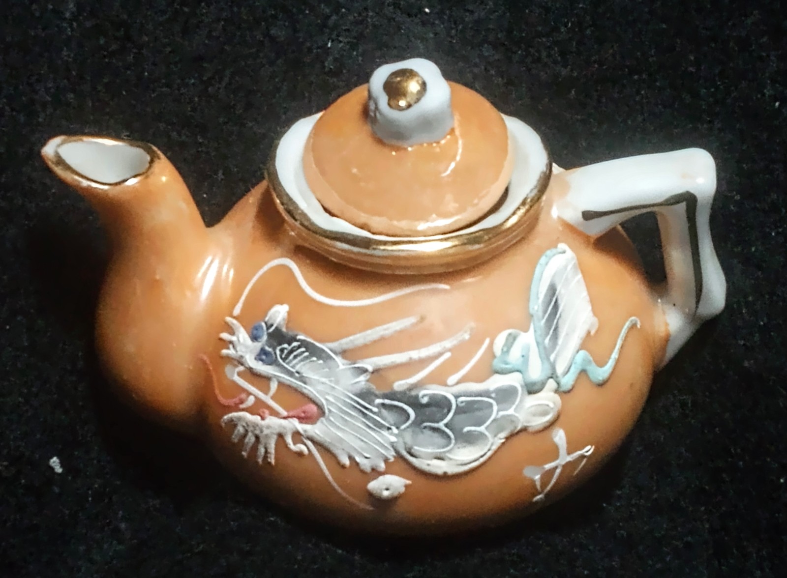 Minature porcelain dragon ware teapot marigold orange color w dragon