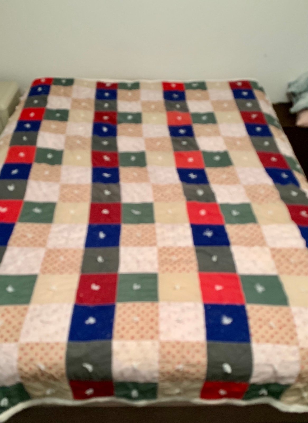 Small square quilt with a soft cream colored fleece back backing