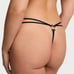 XS black thong with star hardware