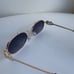 Miu Miu Oval Sunglasses