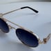 Miu Miu Oval Sunglasses
