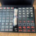 Brand new, unused mahjong tiles, black, with case.