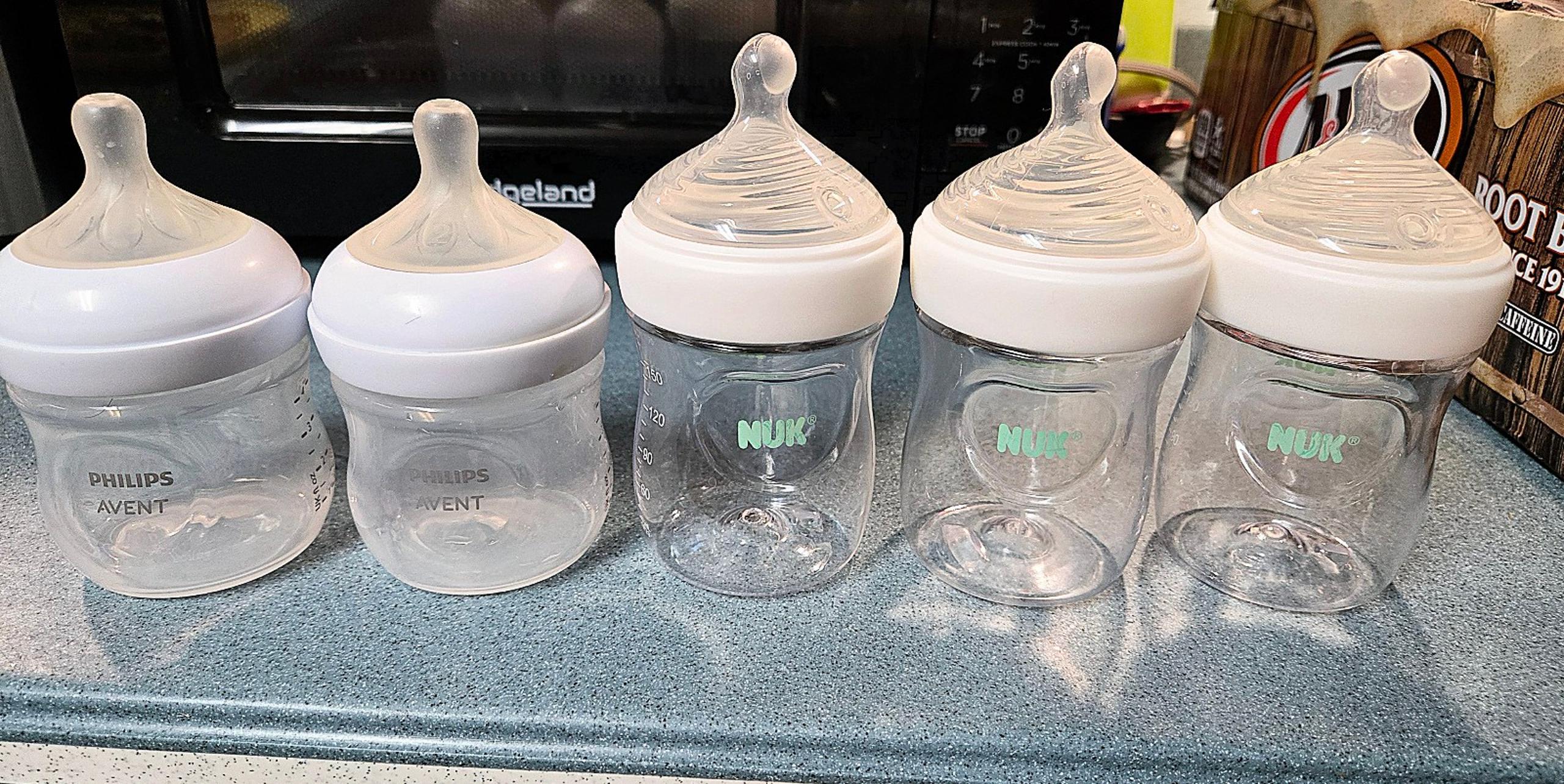 5 baby bottles 3 nuk and 2 Philips Avent