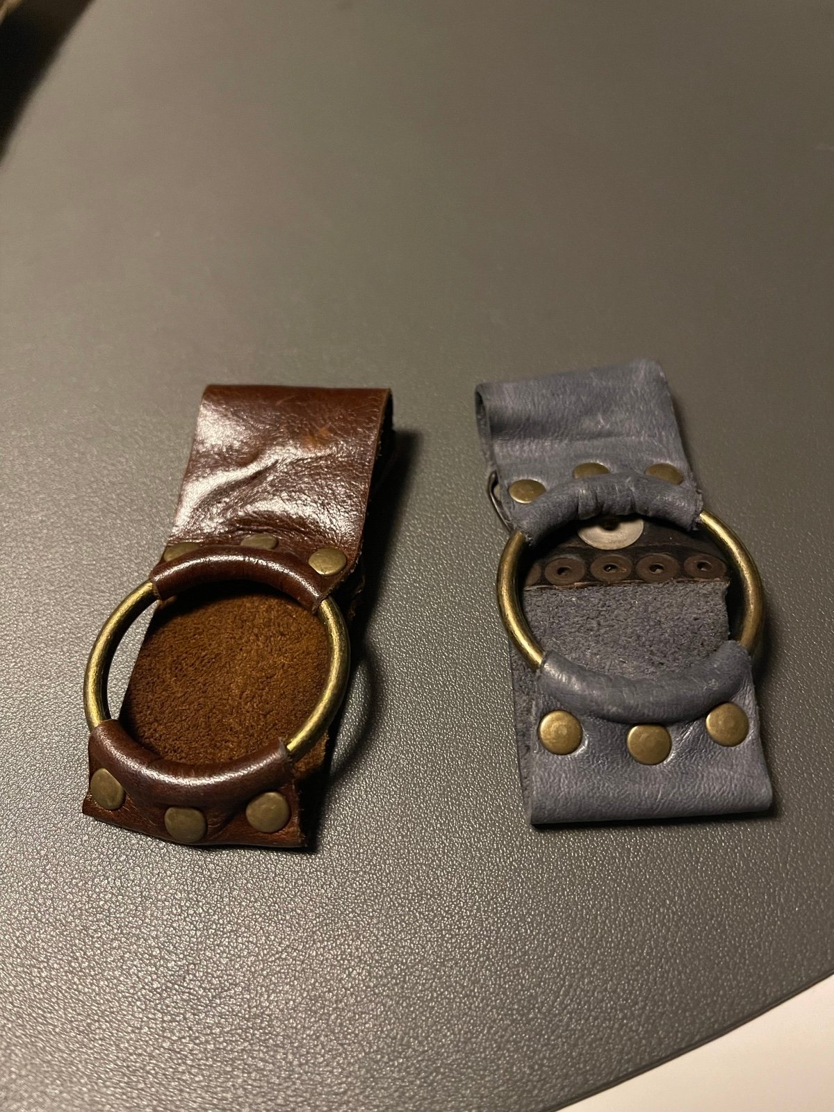 Two unique leather bracelets with metals and snap closure